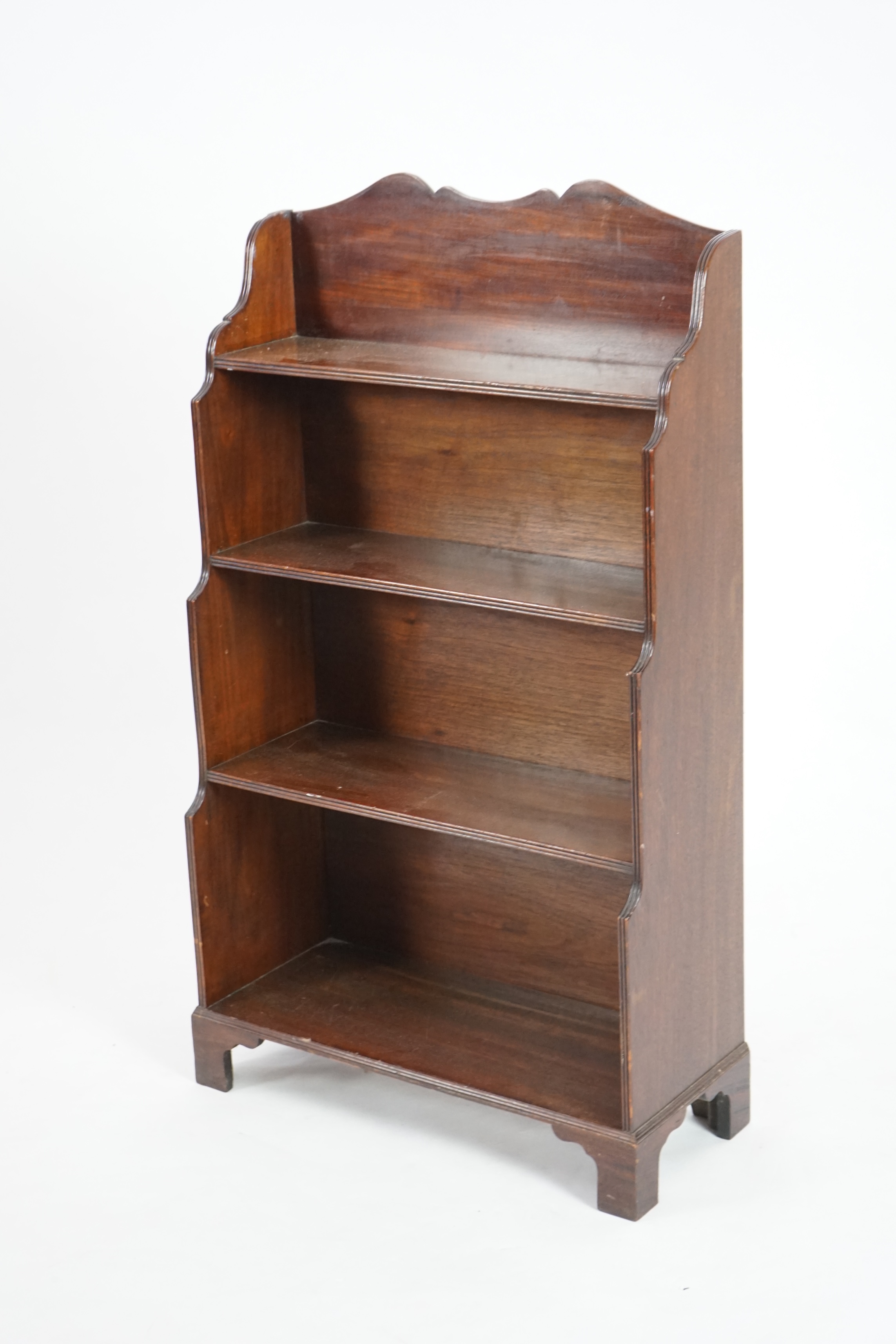 A Regency style mahogany waterfall bookcase